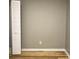 Bedroom with wood floors, neutral wall color and white closet and baseboards at 1140 Smith Sw St, Atlanta, GA 30310