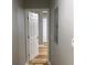 Hallway featuring hardwood floors and a freshly painted interior, offering a clean aesthetic at 1140 Smith Sw St, Atlanta, GA 30310