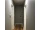 An efficient hallway with hardwood floors connects different areas within the home at 1140 Smith Sw St, Atlanta, GA 30310