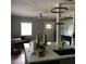 Open-concept kitchen with an island, granite countertops, modern lighting, and stainless steel appliances at 1140 Smith Sw St, Atlanta, GA 30310