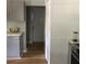 Bright kitchen featuring gray cabinets, white countertops, stainless steel appliances, and hardwood floors at 1140 Smith Sw St, Atlanta, GA 30310