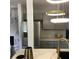 Modern kitchen with stainless steel appliances, gray cabinets, and marble countertops at 1140 Smith Sw St, Atlanta, GA 30310