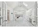 Bright bathroom features a soaking tub, marble floors, and a double vanity with a large window at 6030 Chimney Springs Rd, Buford, GA 30518