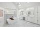 Spacious bathroom with tub, double vanity and marble floors at 6030 Chimney Springs Rd, Buford, GA 30518