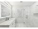 Bright bathroom featuring marble countertop, modern vanity, and glass-enclosed shower with tile accents at 6030 Chimney Springs Rd, Buford, GA 30518