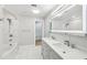 Bright bathroom featuring double vanity, a separate shower and bathtub, and modern fixtures at 6030 Chimney Springs Rd, Buford, GA 30518