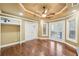 Bedroom featuring hardwood floors, neutral paint and multiple windows and closet space at 6030 Chimney Springs Rd, Buford, GA 30518