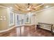 Bedroom with beautiful hardwood floors, French doors leading to a patio, and neutral paint at 6030 Chimney Springs Rd, Buford, GA 30518