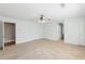 Bedroom with neutral carpet, white walls and trim, ceiling fan and multiple access doors at 6030 Chimney Springs Rd, Buford, GA 30518