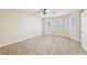 Neutral bedroom featuring plush carpeting and bay windows at 6030 Chimney Springs Rd, Buford, GA 30518