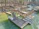 A large dock features a sundeck, boat slips with lifts, lights and a staircase at 6030 Chimney Springs Rd, Buford, GA 30518