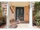 Elegant double doors framed by stately columns and brickwork, offering a grand entrance at 6030 Chimney Springs Rd, Buford, GA 30518