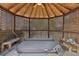 Hot tub in the gazebo with wooden benches at 6030 Chimney Springs Rd, Buford, GA 30518