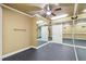 Well-lit exercise room featuring mirrored walls, rubber floor and ceiling fan at 6030 Chimney Springs Rd, Buford, GA 30518