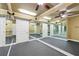 Home gym showcasing mirrored walls, rubber floors, and ceiling fan, perfect for fitness enthusiasts at 6030 Chimney Springs Rd, Buford, GA 30518