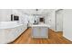 Bright kitchen featuring ample counter space, white subway tile backsplash, and hardwood floors at 6030 Chimney Springs Rd, Buford, GA 30518