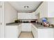 Features a kitchenette with white cabinets and a stainless steel sink at 6030 Chimney Springs Rd, Buford, GA 30518
