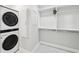 Laundry area featuring stacked washer and dryer at 6030 Chimney Springs Rd, Buford, GA 30518
