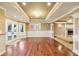 Hardwood floor living room features neutral colors, an access door and fireplace at 6030 Chimney Springs Rd, Buford, GA 30518