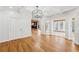 Open living space with hardwood floors and views of the backyard, seamlessly connecting to other rooms at 6030 Chimney Springs Rd, Buford, GA 30518