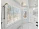 Walk-in shower featuring a rain shower head, body jets, and scenic views at 6030 Chimney Springs Rd, Buford, GA 30518