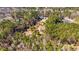 An aerial view displays a beautiful lot surrounded by lush trees at 150 Hillred Dr, Fayetteville, GA 30215