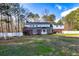 An expansive backyard featuring a well-maintained lawn and mature trees at 150 Hillred Dr, Fayetteville, GA 30215