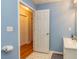 Bathroom with blue walls, tile flooring, and a white vanity at 150 Hillred Dr, Fayetteville, GA 30215