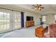 Spacious bedroom with french doors, a ceiling fan, and plenty of natural light at 150 Hillred Dr, Fayetteville, GA 30215