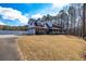 Spacious brick home boasts an attached garage and a well-maintained lawn, perfect for Gathering living at 150 Hillred Dr, Fayetteville, GA 30215