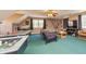 Large, versatile game room featuring a foosball table, tv, and cozy seating, perfect for entertaining and relaxation at 150 Hillred Dr, Fayetteville, GA 30215
