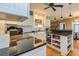 Stylish kitchen with white cabinets, black countertops, and a center island with storage at 150 Hillred Dr, Fayetteville, GA 30215