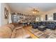 Gathering room features hardwood floors, a ceiling fan, and a decorative wall, creating a cozy atmosphere at 150 Hillred Dr, Fayetteville, GA 30215