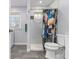 Updated bathroom with modern fixtures, a walk-in shower, and a unique shower curtain at 2100 Shady Ln, Tucker, GA 30084
