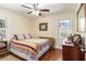 Bedroom with hardwood floors, natural light, and colorful accents at 2100 Shady Ln, Tucker, GA 30084