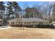Charming one-story home features a welcoming entrance and a well-manicured lawn at 2100 Shady Ln, Tucker, GA 30084