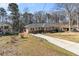 Attractive one-story house with a long drive way, featuring beautiful yard at 2100 Shady Ln, Tucker, GA 30084