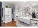 Well-appointed kitchen with a farmhouse sink, granite countertops and updated fixtures at 2100 Shady Ln, Tucker, GA 30084
