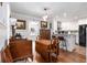 Charming dining area adjacent to the kitchen features elegant lighting and vintage furnishings at 2100 Shady Ln, Tucker, GA 30084