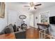 Cozy living room features hardwood floors, neutral walls, and a ceiling fan at 2100 Shady Ln, Tucker, GA 30084