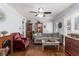 Cozy living area with hardwood flooring, a fireplace, and well-lit by natural light at 2100 Shady Ln, Tucker, GA 30084