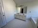 Bright bathroom with double sinks and a large mirror at 2979 Belfaire Crest Ct, Dacula, GA 30019