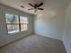 Neutral bedroom featuring a large window for ample natural light at 2979 Belfaire Crest Ct, Dacula, GA 30019