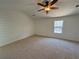 Bright bedroom with white horizontal paneling and a ceiling fan at 2979 Belfaire Crest Ct, Dacula, GA 30019