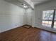 Entryway featuring wood floors, shiplap accent wall, and a large window at 2979 Belfaire Crest Ct, Dacula, GA 30019