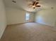 Large main bedroom with neutral carpet and a ceiling fan at 2979 Belfaire Crest Ct, Dacula, GA 30019