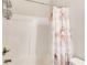 Clean white bathroom with a shower and tub combo, complete with a Paris-themed shower curtain at 50 Crabapple Ridge Dr, Oxford, GA 30054