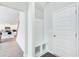 Bright entryway featuring a built-in bench with storage cubbies and a coat rack at 50 Crabapple Ridge Dr, Oxford, GA 30054
