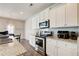 Modern kitchen features stainless steel appliances, granite countertops, and ample cabinet space at 50 Crabapple Ridge Dr, Oxford, GA 30054