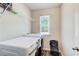 Functional laundry room with modern washer and dryer units and ample storage space at 50 Crabapple Ridge Dr, Oxford, GA 30054